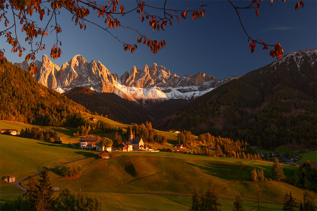 Golden-hour light over Santa Magdalena Church and the Odle peaks in Val di Funes in the Dolomites